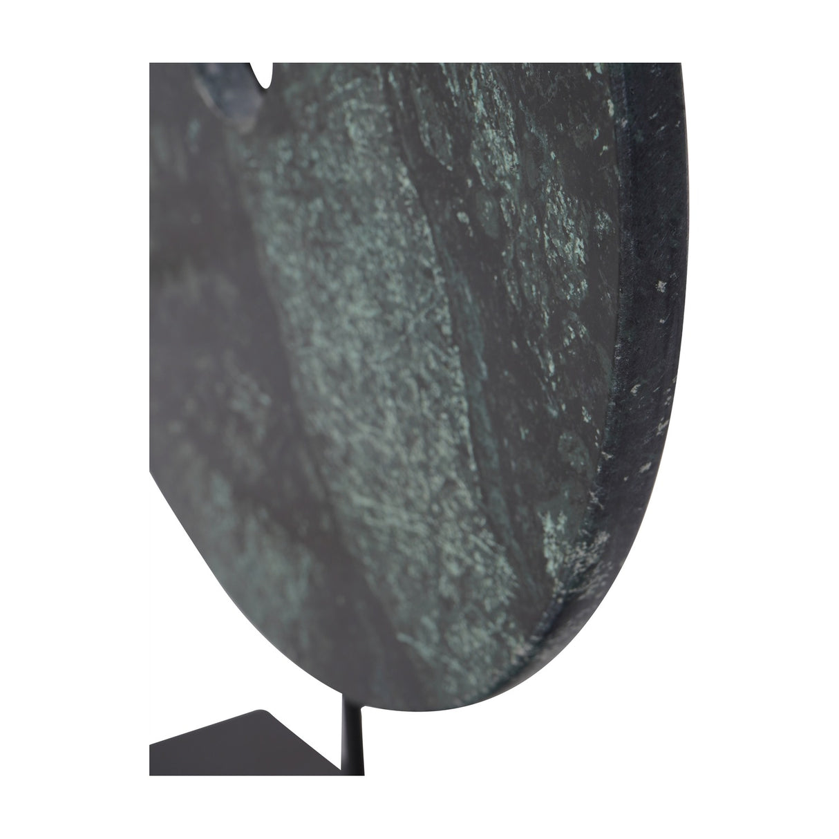 Close-up of Libra Interiors Green Marble Disc Sculpture showing textured deep green and black marble on a slim matt black iron stem and base.