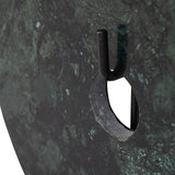 Close-up of Libra Interiors Green Marble Disc Sculpture showing the central opening, veined deep green marble surface and black iron stem support.