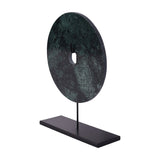 Libra Interiors Green Marble Disc Sculpture with a small central opening, mounted upright on a slim matt black iron stem and flat plinth base.