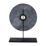 Libra Interiors Green Marble Disc Sculpture with a veined dark green and black stone disc on a slim black iron stem and flat matt base.