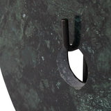 Close-up of Libra Interiors Green Marble Disc Sculpture showing the central opening and black iron stem set into the veined deep green marble face.