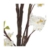 Close-up of the Libra Interiors Potted White Blossom Cherry artificial tree, showing slim brown branches with clustered white blossoms and small green leaves.