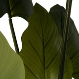 Close-up of Libra Interiors Tall Faux Foliage Giant Tora artificial plant, showing broad green polyethylene leaves with central veins on slender stems.
