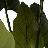 Close-up of Libra Interiors Tall Faux Foliage Giant Tora artificial plant showing broad green polyethylene leaves with central veins on slender stems.