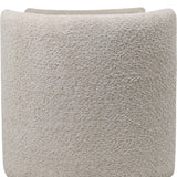 Close-up of the Libra Interiors Textured Boucle Storage Ottoman in cream, showing the looped bouclé upholstery and softly curved end panel.