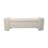 Libra Interiors Textured Boucle Storage Ottoman in cream with curved end panels and a long padded lift-up lid, shown on a plain white background.