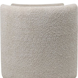 Close-up of the cream bouclé upholstery on the Libra Interiors Textured Boucle Storage Ottoman, showing the looped, tactile weave and curved end panel.