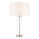 Endon Caldley table lamp with clear cylindrical glass base, bright nickel fittings and vintage white faux silk drum shade, on a plain white background.