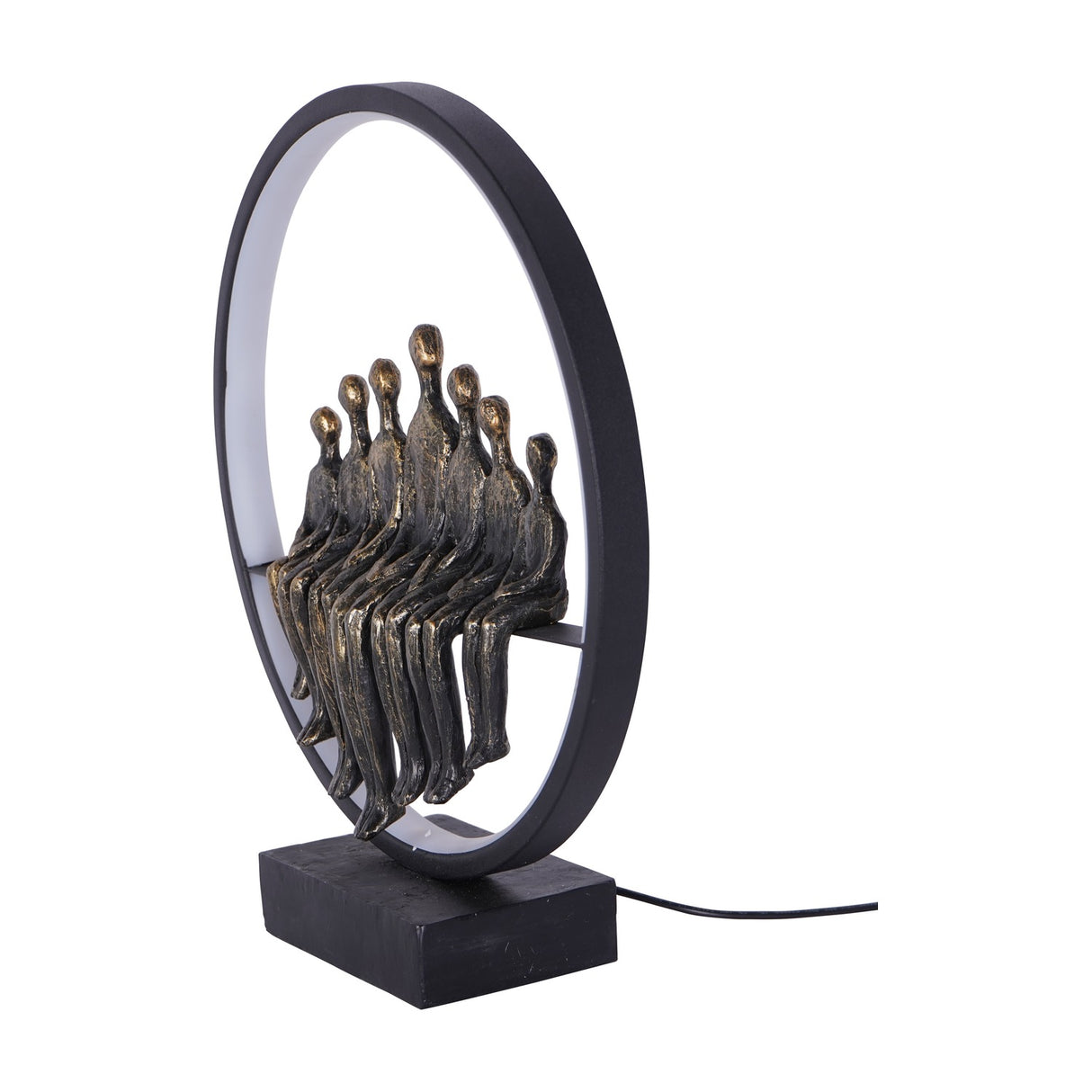 Libra Interiors Bronze Family Circle LED lighting accessory with seven seated resin figures in antique bronze inside a black metal ring on a solid base.