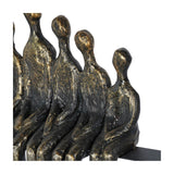 Close-up of the Libra Interiors Bronze Family Circle LED lighting accessory showing seated resin figures with a textured, distressed antique bronze finish.