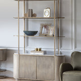 Libra Interiors Openwork Cast Aluminium Photo Frame in gold with honeycomb border, styled on a shelving unit beside a blue bowl in a panelled room.