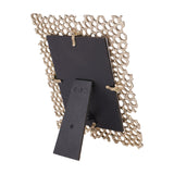 Rear view of the Libra Interiors Openwork Cast Aluminium Photo Frame in gold, showing the black backing board and fold-out easel stand.