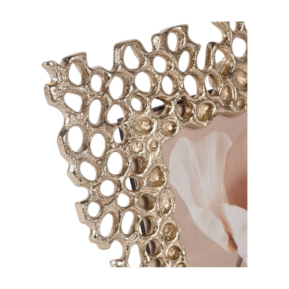 Close-up of Libra Interiors Openwork Cast Aluminium Photo Frame in gold, showing the honeycomb-inspired border corner and a portrait photo behind glass.
