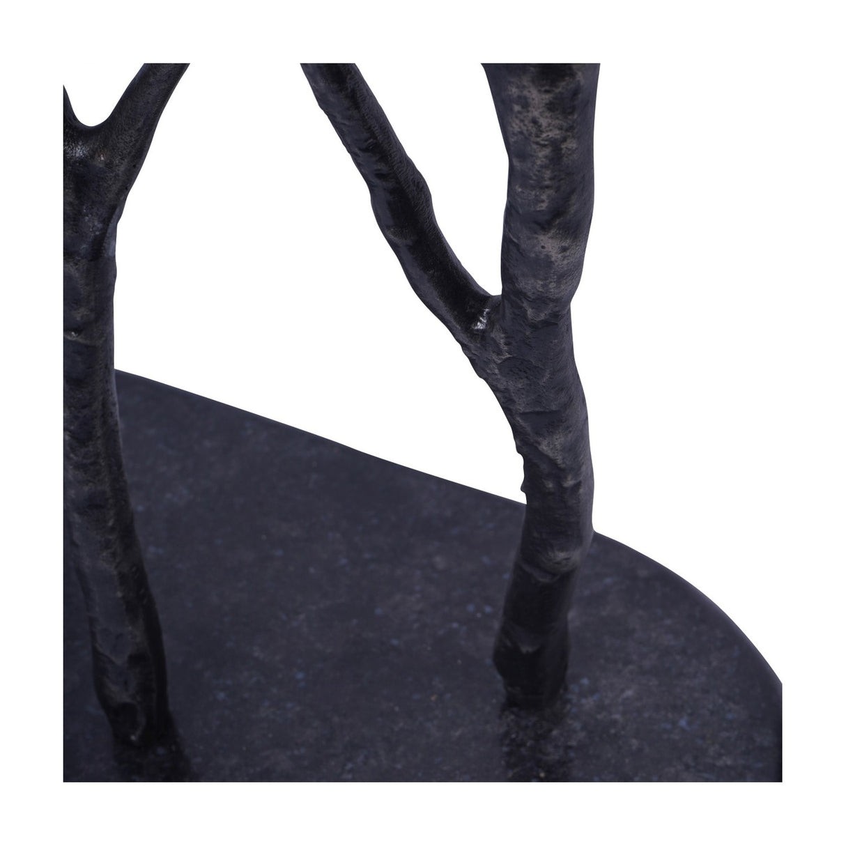 Close-up of the Libra Interiors Aluminium Branch and Bird Floor Sculpture base, showing matt black cast aluminium branches rising from a heavy oval foot.