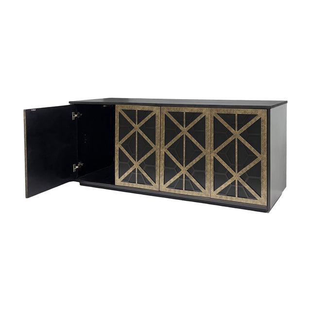 Libra Interiors Fretwork sideboard in black-washed mango wood with three visible geometric iron fretwork doors in gilded dark bronze, one door open.