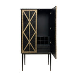 Libra Interiors Fretwork two-door drinks cabinet in black-washed mango wood with gilded bronze geometric iron doors, one door open showing bottle storage.