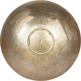 Rear view of Libra Interiors Round Textured Aluminium Wall Art in antique brass, showing the central mounting ring and hanging bracket on the concave back.