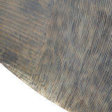 Close-up of Libra Interiors Round Textured Aluminium Wall Art in antique brass, showing hand-applied concentric line detailing and rippled edge texture.