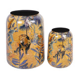 Libra Interiors Textured Iron Cylinder Planters in blue with gold-flecked jungle motifs of lions, monkeys and palms, shown as a tall and short pair.