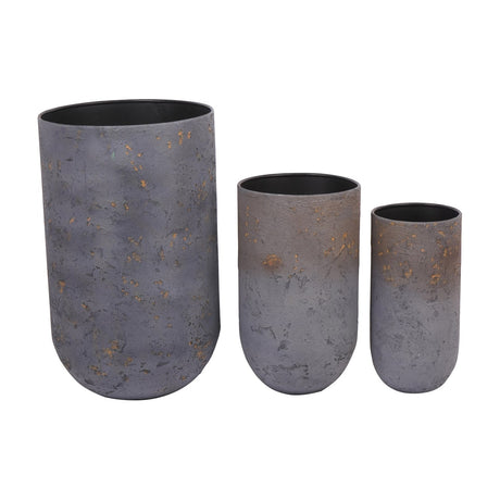 Libra Interiors Textured Iron Rustic Fleck set of three planters in blue with gold and grey flecks, rounded cylindrical bodies in graduated sizes.