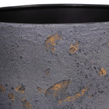 Close-up of Libra Interiors Textured Iron Rustic Fleck planter showing the deep blue powder-coated surface with gold and grey flecks and black inner rim.