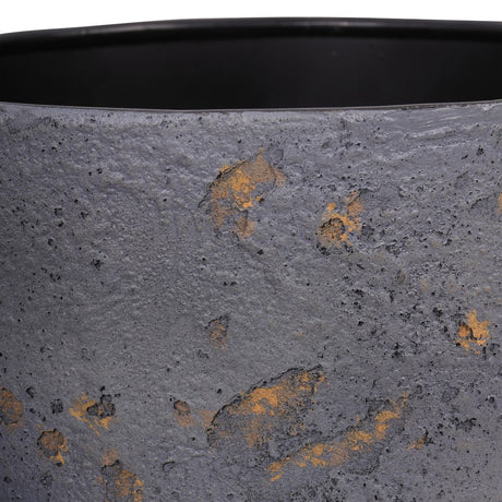 Close-up of Libra Interiors Textured Iron Rustic Fleck planter showing the deep blue powder-coated surface with gold and grey flecks and black inner rim.