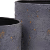 Close-up of two Libra Interiors Textured Iron Rustic Fleck planters showing deep blue powder-coated cylindrical bodies with gold and grey flecks.