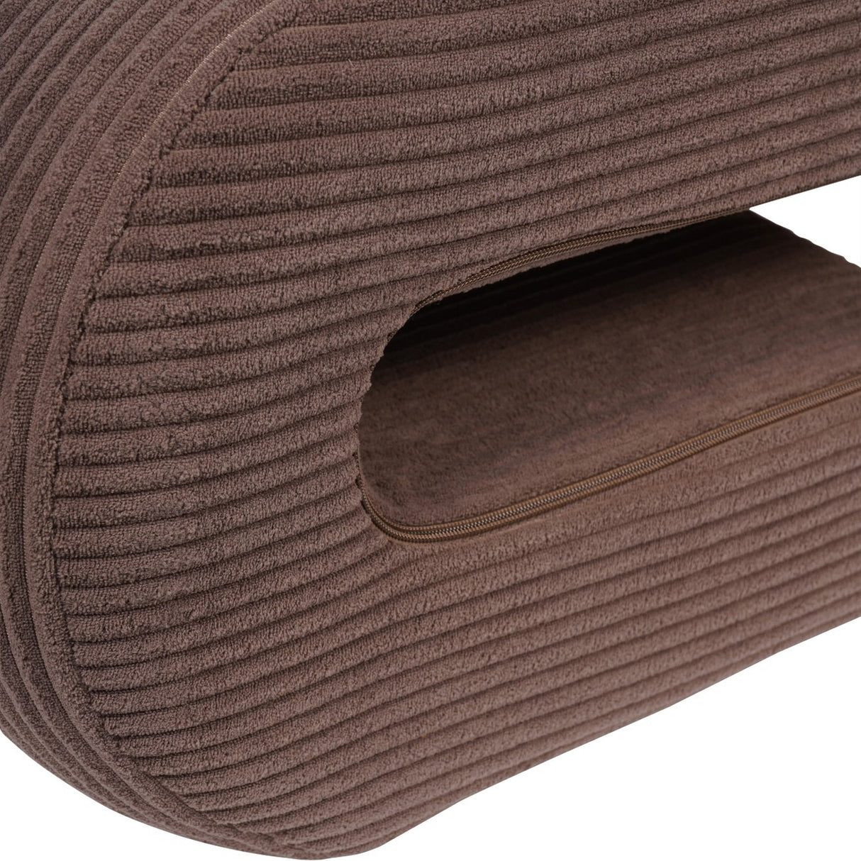Close-up of the Libra Interiors Curved Corduroy Accent Armchair in brown, showing the ribbed cord texture and looped sculptural base with zip detail.