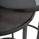 Close-up of Libra Interiors Slate Effect Iron Nesting Side Tables in black, showing the tinted glass top over the textured slate-effect lower table.