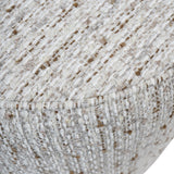 Close-up of Libra Interiors Textured Swivel Fabric Armchair in natural, showing the ivory, sand and almond flecked slub weave upholstery and seam detail.