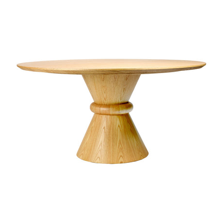 Libra Interiors Round Oak Veneer Pedestal Dining Table in natural finish, with a circular top on a double-cone base joined by a rounded central ring.