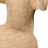 Close-up of the Libra Interiors Curved Back Upholstered Dining Chair in wheat, showing the woven beige fabric texture across the curved backrest and seat.
