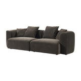 Libra Interiors Velvet Curved 2-Seater Modular Sofa in brown velvet with sculptural curves, deep cushions and four scatter cushions, on white.