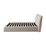 Libra Interiors beige chenille upholstered king bed, side view showing curved padded headboard, wraparound base and slatted timber interior on white.