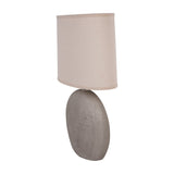 Libra Interiors Textured Ceramic Oval Table Lamp in grey with concentric ring pattern and neutral linen-look drum shade, on a plain white background.
