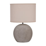Libra Interiors Textured Ceramic Oval Table Lamp in grey with a rounded base showing concentric ring pattern and neutral linen-look drum shade.