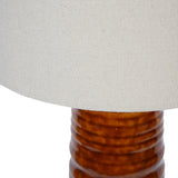 Close-up of Libra Interiors Ribbed Ceramic Tapered Floor Lamp showing the terracotta glazed base with horizontal ribbing beneath a neutral linen shade.