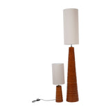 Libra Interiors ribbed terracotta ceramic tapered floor lamp beside a smaller matching table lamp, both with cylindrical off-white shades on a plain background.
