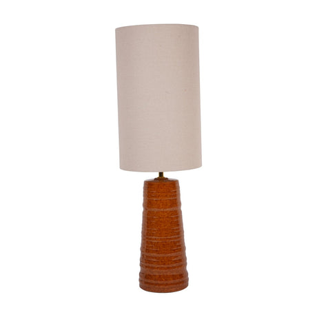 Libra Interiors Ribbed Ceramic Terracotta Table Lamp with a tapered banded base and tall cylindrical cream fabric shade, shown on a plain white background.