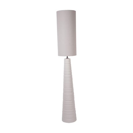 Libra Interiors Ribbed Ceramic Tall Floor Lamp in white with tapered horizontally banded base and long cylindrical neutral fabric shade on a white background.