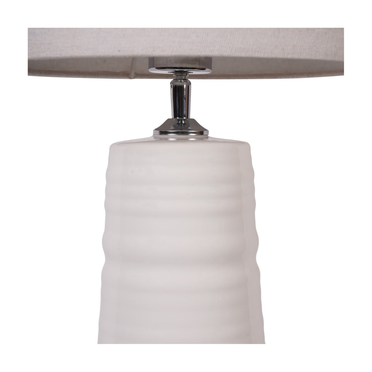 Close-up of the Libra Interiors Ribbed Ceramic Tall Floor Lamp in white, showing the ribbed glazed base, chrome fitting and neutral fabric shade.