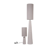 Libra Interiors Ribbed Ceramic Tall Floor Lamp in white shown beside a smaller matching table lamp, both with tapered ribbed bases and cylindrical shades.