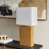 Libra Interiors Ridged Ceramic Rectangular Table Lamp in brown with vertically ridged terracotta base and cream linen shade on a dark console.