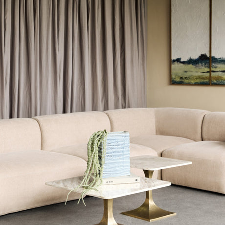 Libra Interiors Rippled Ceramic Rectangular Vase in blue with trailing faux amaranthus, styled on marble and brass side tables beside a neutral sofa.