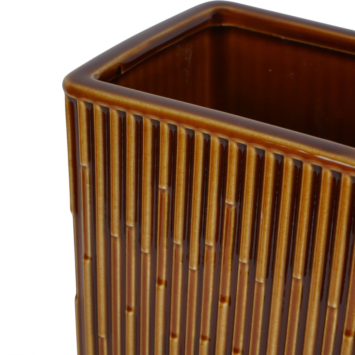 Close-up of the Libra Interiors ribbed ceramic vase in glossy terracotta brown, showing the rectangular rim and fine vertical ridges along each side.