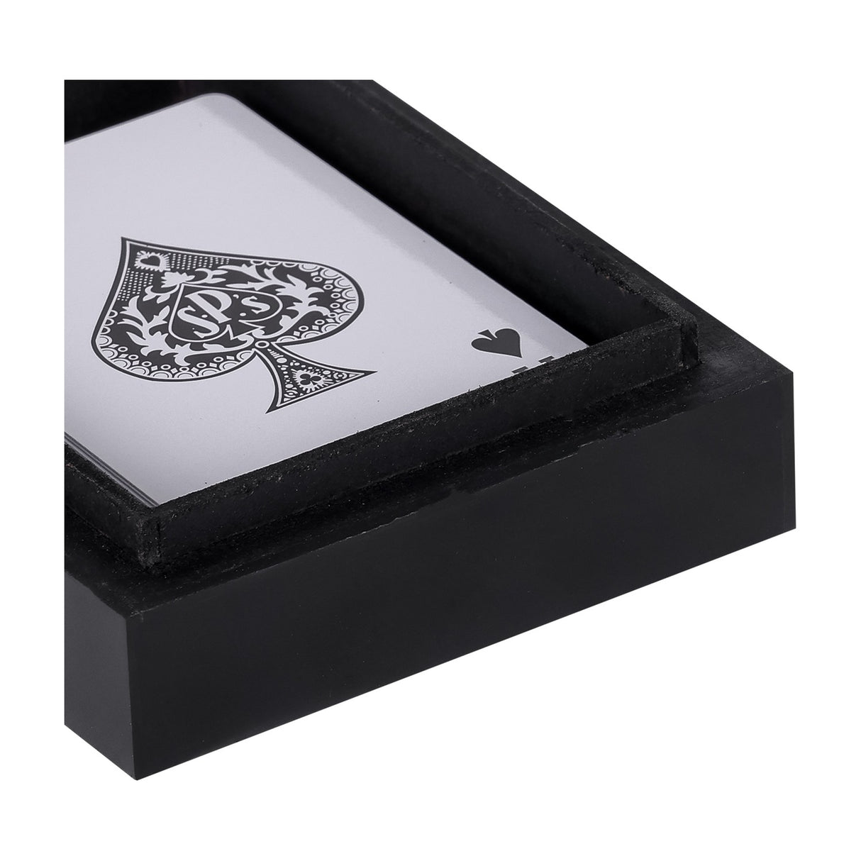 Close-up of the Libra Interiors Ace of Spades black resin card box, showing the lacquered corner and an ace of spades playing card inside.