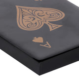 Close-up of the Libra Interiors Ace of Spades black resin card game box, showing the gold filigree spade motif on the lacquered lid.