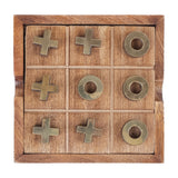 Libra Interiors Mango Wood Noughts and Crosses game shown from above with brass crosses and rings arranged on a square wooden grid tray.