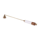 Libra Interiors Brass and Bone Inlay Candle Snuffer with bell-shaped antique brass head, slim rod, white bone inlay handle and turned wood detailing.