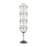 Libra Interiors Brushed Brass Four-Dial World City Floor Clock with vertically stacked New York, London, Hong Kong and Sydney dials on a pedestal base.